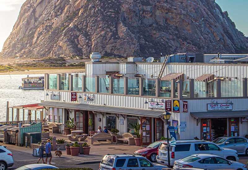 Morro Bay shops with Morro rock in background